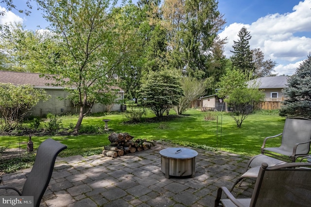 view of patio / terrace with an outdoor fire pit