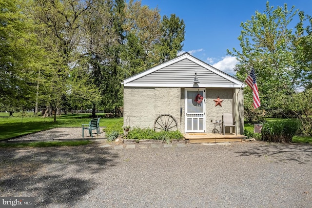 view of outbuilding featuring a yard