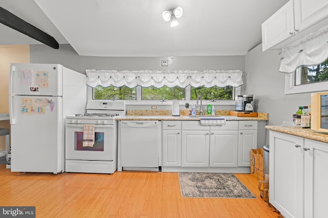 kitchen with white cabinets, a healthy amount of sunlight, and white appliances