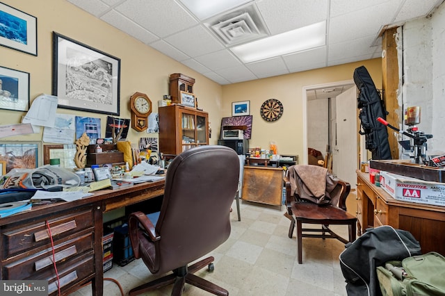 home office featuring a paneled ceiling