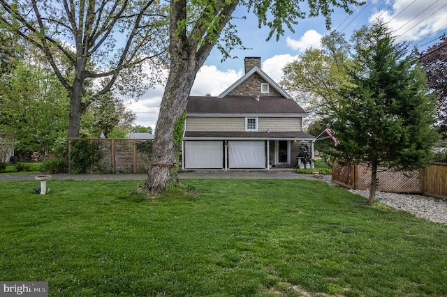 back of house featuring a yard