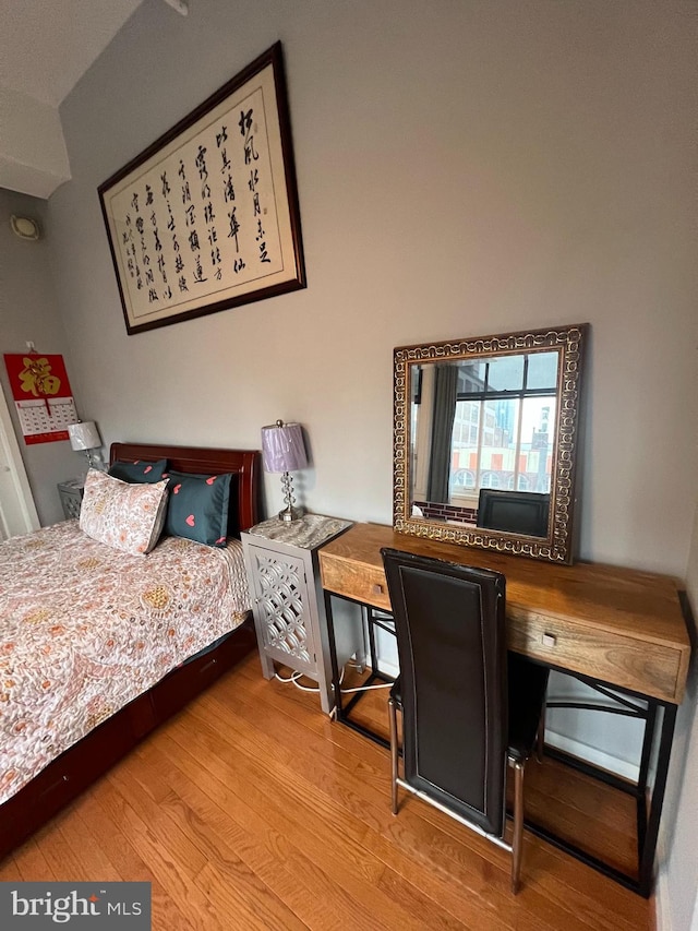 bedroom featuring hardwood / wood-style floors