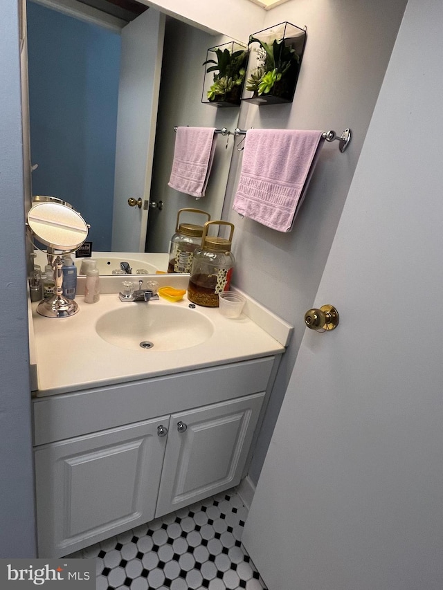 bathroom with vanity and tile flooring