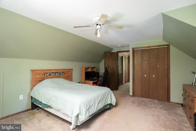 carpeted bedroom featuring a closet, ceiling fan, and vaulted ceiling