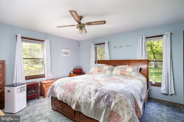 carpeted bedroom with ceiling fan