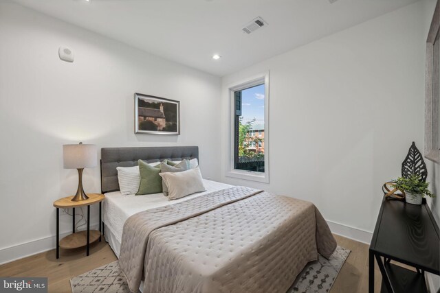 bedroom featuring light hardwood / wood-style floors