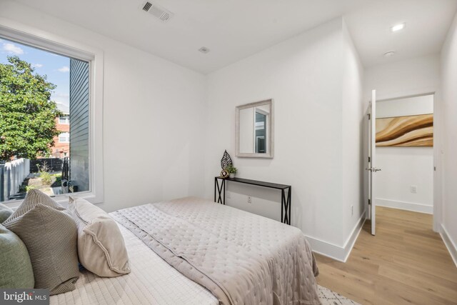 bedroom with light wood-type flooring