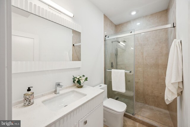 bathroom featuring walk in shower, vanity, and toilet