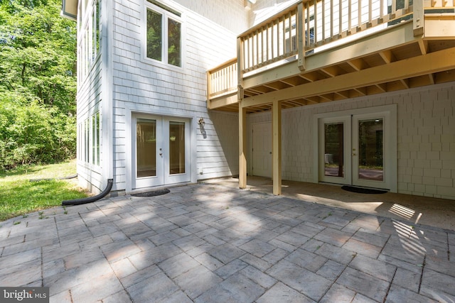 view of patio / terrace featuring a balcony and french doors