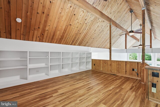 additional living space featuring hardwood / wood-style flooring and lofted ceiling