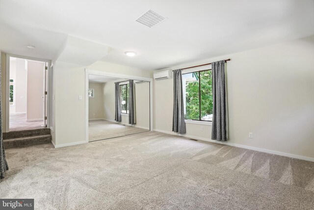 unfurnished bedroom with access to exterior, carpet floors, and a closet