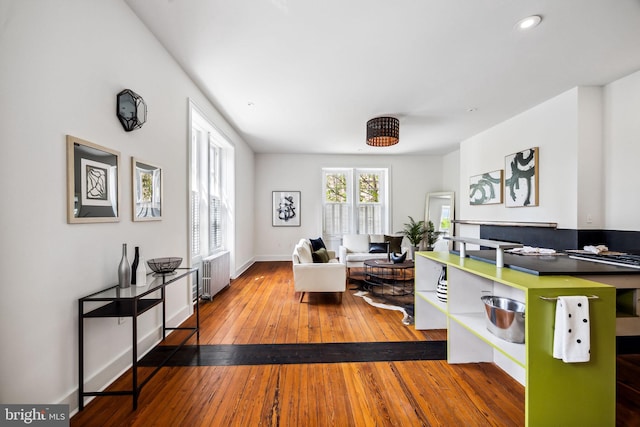 interior space featuring hardwood / wood-style floors and radiator heating unit