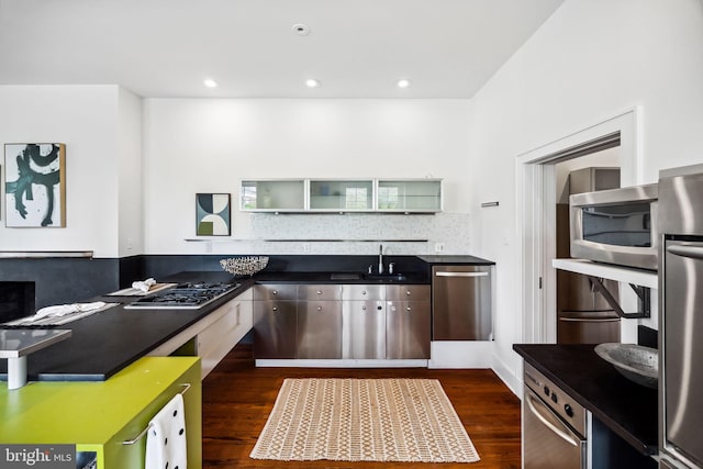 kitchen featuring stainless steel appliances, dark hardwood / wood-style floors, and sink