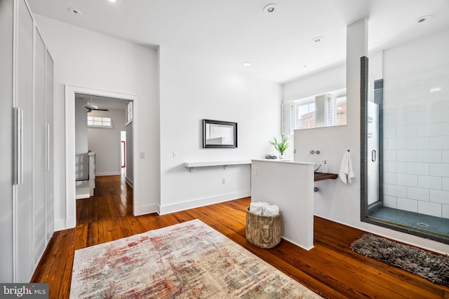 bathroom featuring ceiling fan and hardwood / wood-style floors