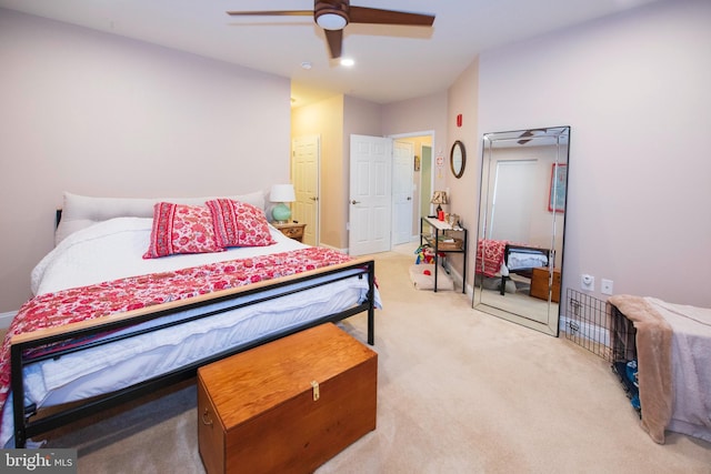 bedroom featuring ceiling fan and light colored carpet