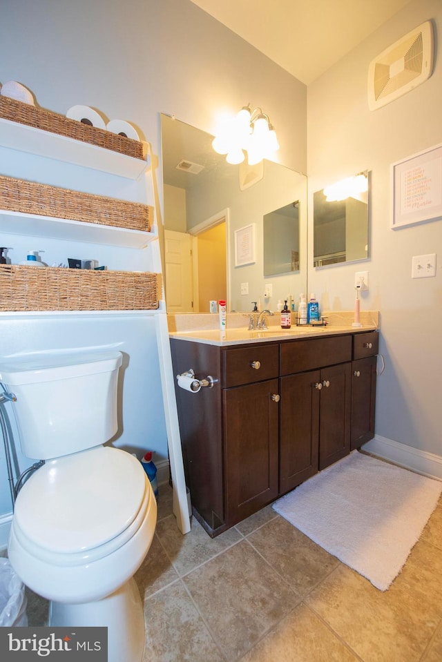 bathroom featuring tile patterned flooring and vanity