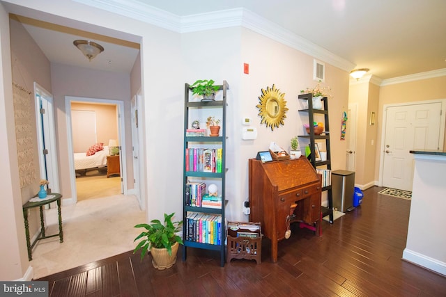 misc room with crown molding and dark hardwood / wood-style flooring