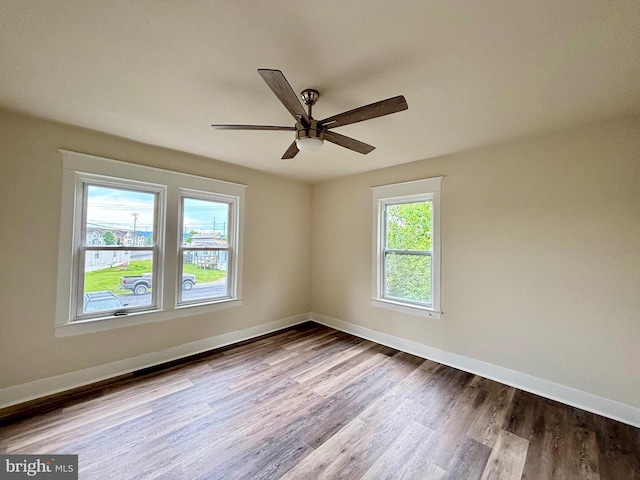 spare room featuring ceiling fan and light hardwood / wood-style flooring