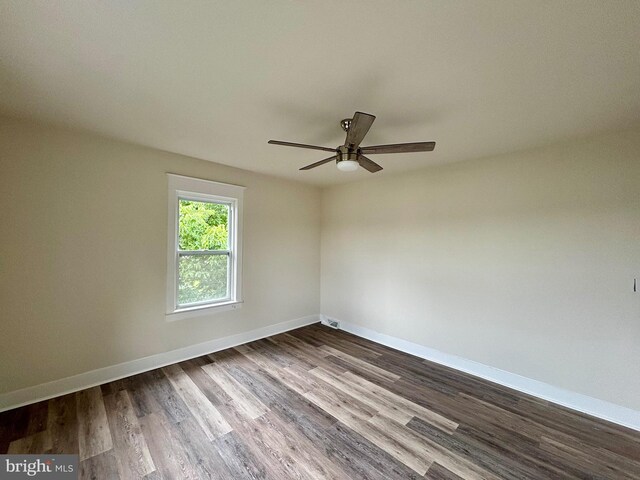 spare room featuring hardwood / wood-style flooring and ceiling fan