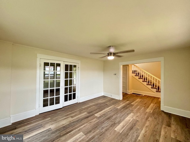 unfurnished room with ceiling fan and wood-type flooring