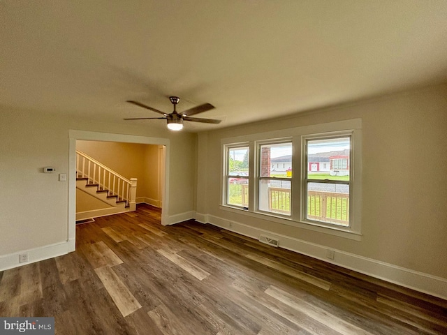 empty room featuring ceiling fan and hardwood / wood-style flooring