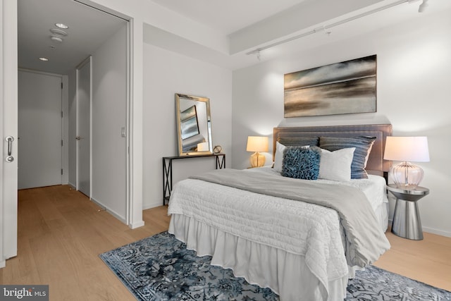 bedroom featuring light wood-type flooring