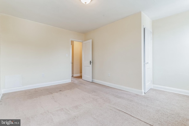 spare room featuring carpet