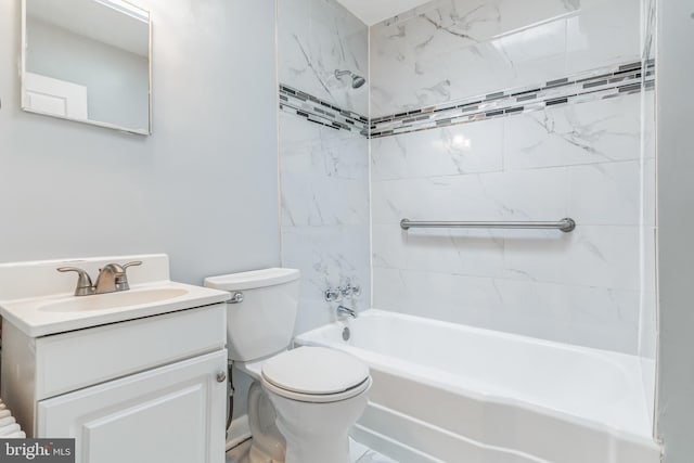 full bathroom featuring vanity with extensive cabinet space, toilet, and tiled shower / bath