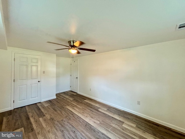 unfurnished bedroom with ceiling fan and hardwood / wood-style floors