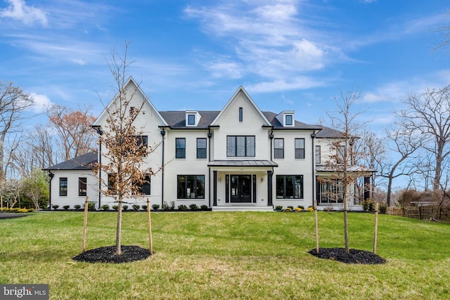 back of house featuring a lawn