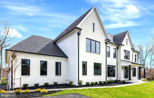 rear view of house with a yard