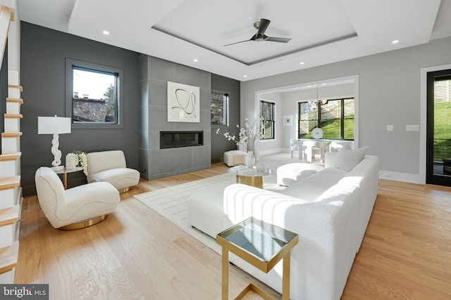 living room with light hardwood / wood-style flooring and a healthy amount of sunlight