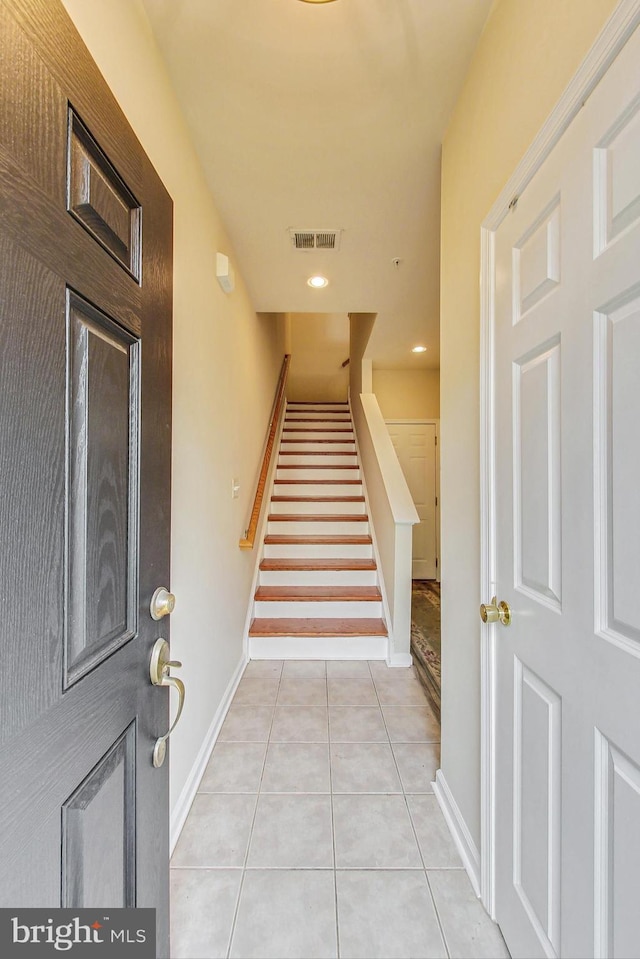 entryway featuring light tile patterned flooring