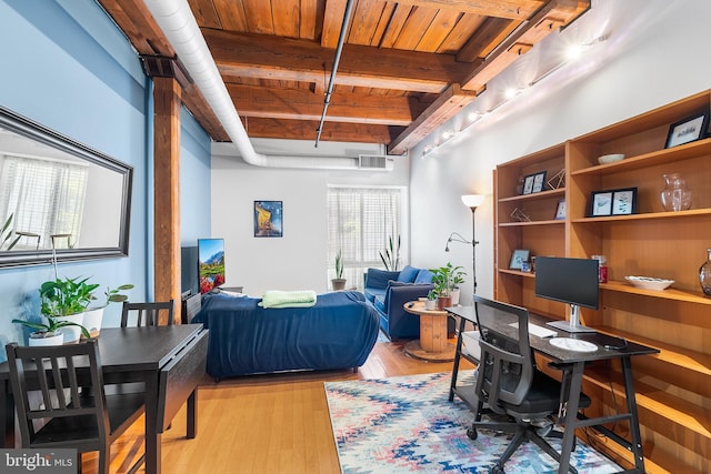 office area with beamed ceiling, wooden ceiling, and light hardwood / wood-style flooring