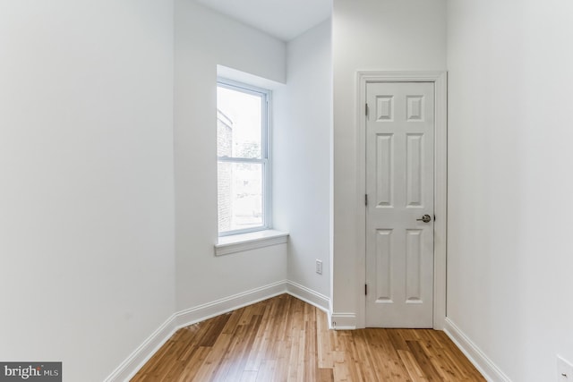 unfurnished room with light hardwood / wood-style flooring