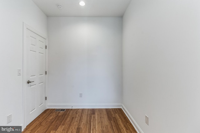 empty room with hardwood / wood-style flooring