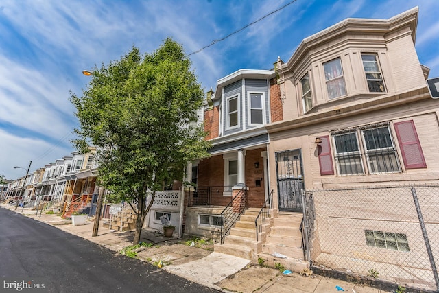 multi unit property featuring a porch