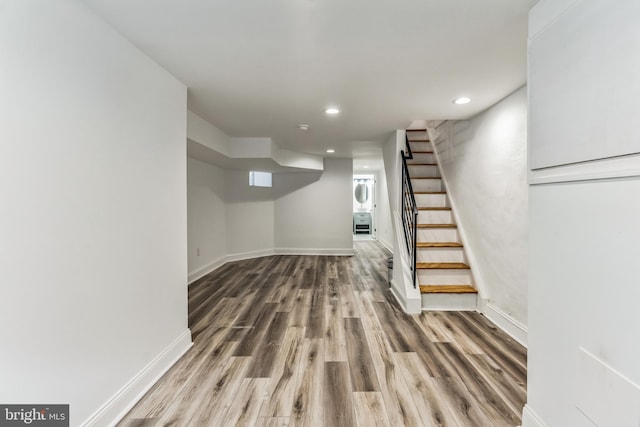 basement featuring hardwood / wood-style floors