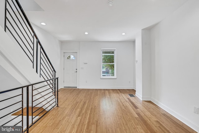 foyer entrance with light wood-type flooring