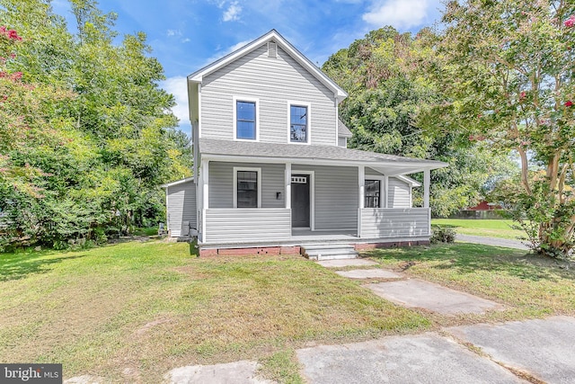 view of front of home with a porch and a front yard