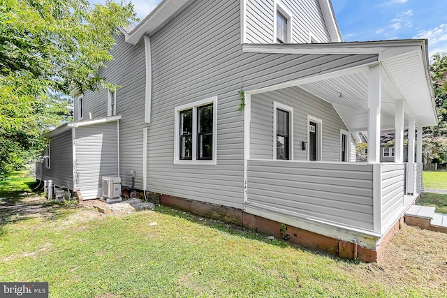 view of side of home featuring a yard