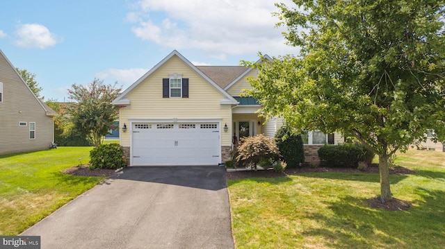 view of front of property featuring a front lawn and a garage