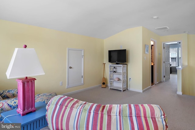 bedroom featuring vaulted ceiling and carpet flooring