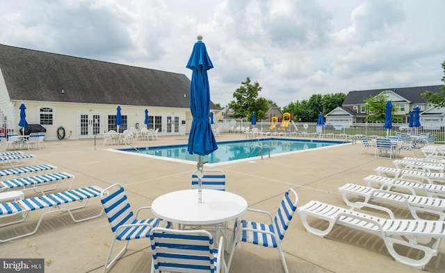 view of pool featuring a patio area