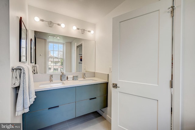 bathroom with tile flooring and dual vanity