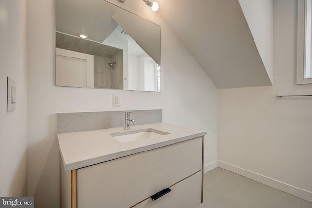 bathroom with tile flooring and vanity