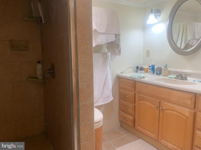 bathroom featuring crown molding, a shower with door, tile floors, and large vanity