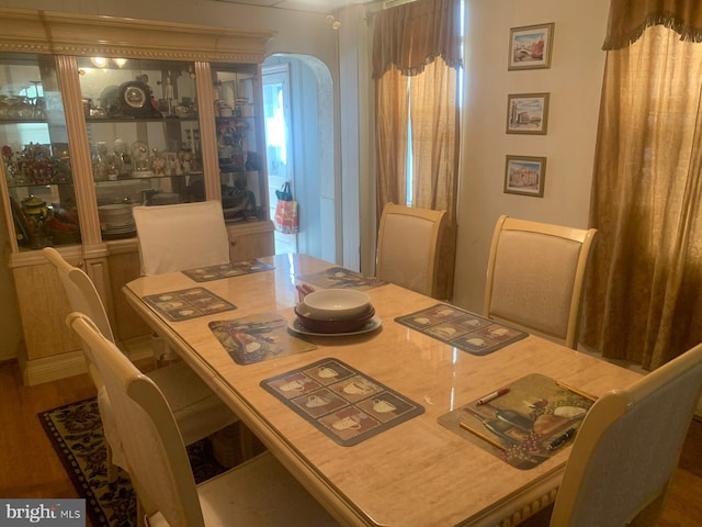 dining space featuring wood-type flooring