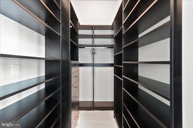 spacious closet featuring light tile floors