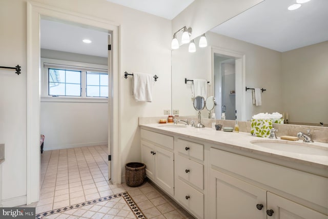 bathroom with tile patterned flooring and vanity